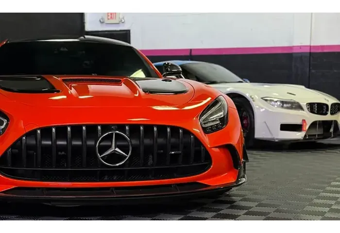 Exotic cars inside the Tasha Car Detailing shop in Miami